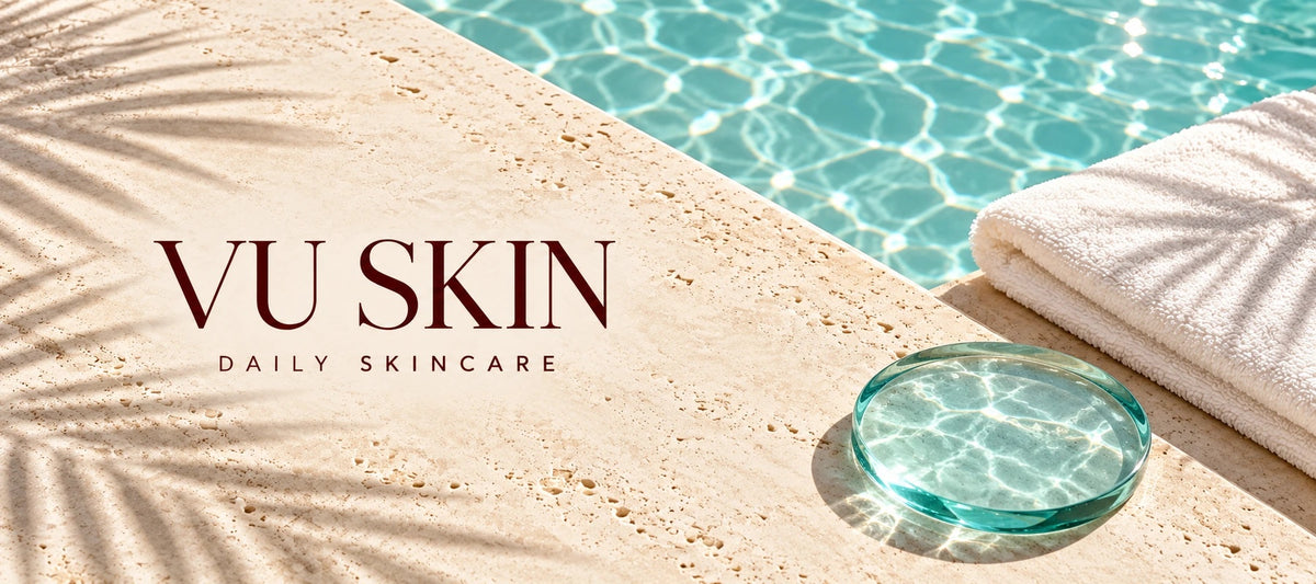 VU SKIN Daily Skincare editorial artwork with a folded white towel and aqua glass disc on travertine beside a pool.